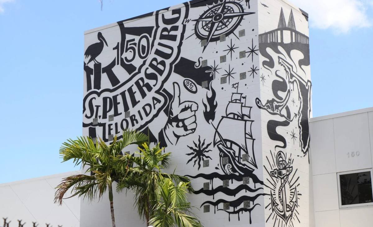 A black and white mural on the side of a building.