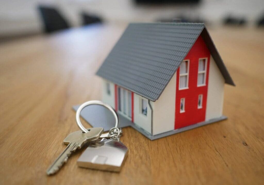 A key is sitting on top of a table.